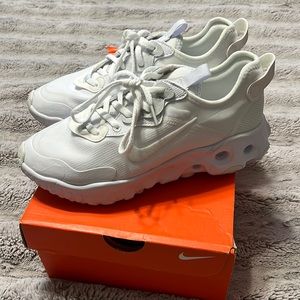 Woman’s white Nike react